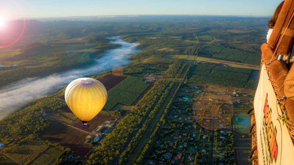 Sunrise Hot Air Balloon Flight near Cairns with Sparkling Wine and Optional Round Trip Transfer (Sunrise Hot Air Balloon Flight with Round Trip Transfer + Sparkling Wine + FREE Digital Photos and Bad Fishy Jet Boating Experience) - 1